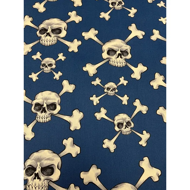 Mönstrat bomullstyg 110cm br. – "skull and bones"